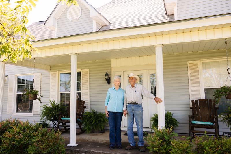 Glen and Teresa Ford on the steps of their family home on their farm in Hempstead County, Arkansas.