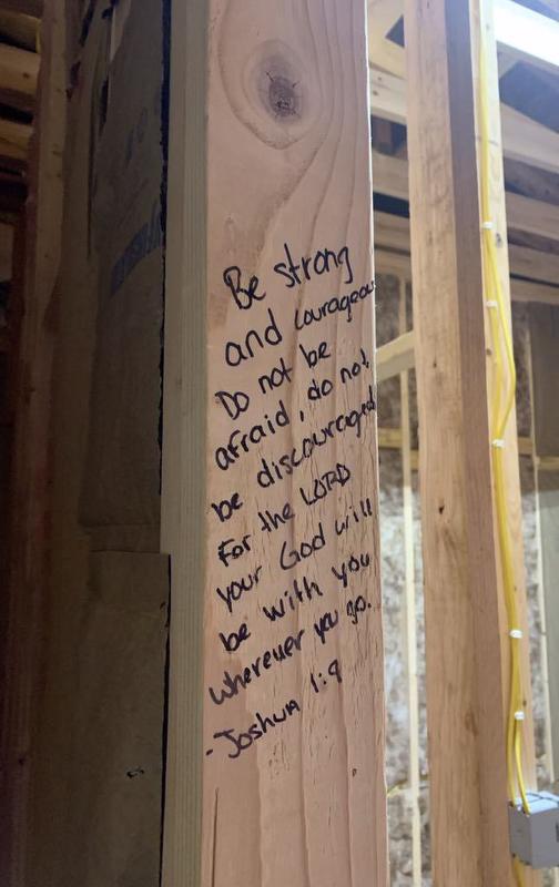 Bible verse written on the house frame board