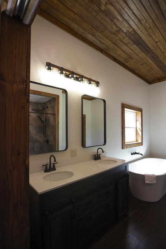 Full view of master bathroom cabinets and tub.